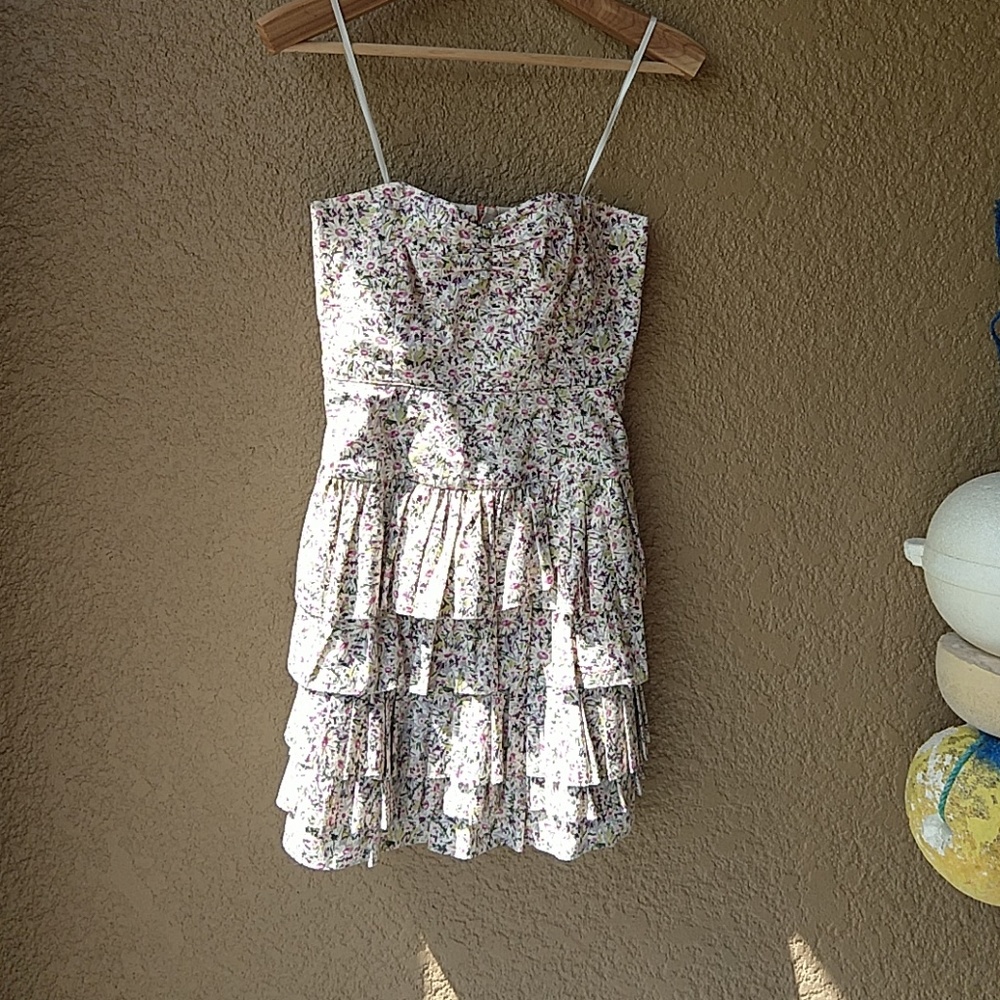 Strapless floral print ruffle skirt party dress.